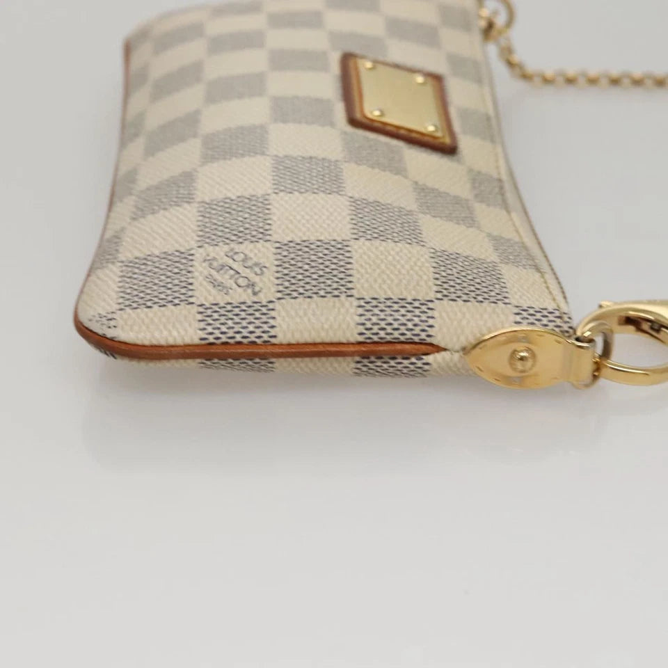 Louis Vuitton   |    Mira White Canvas Clutch Bag