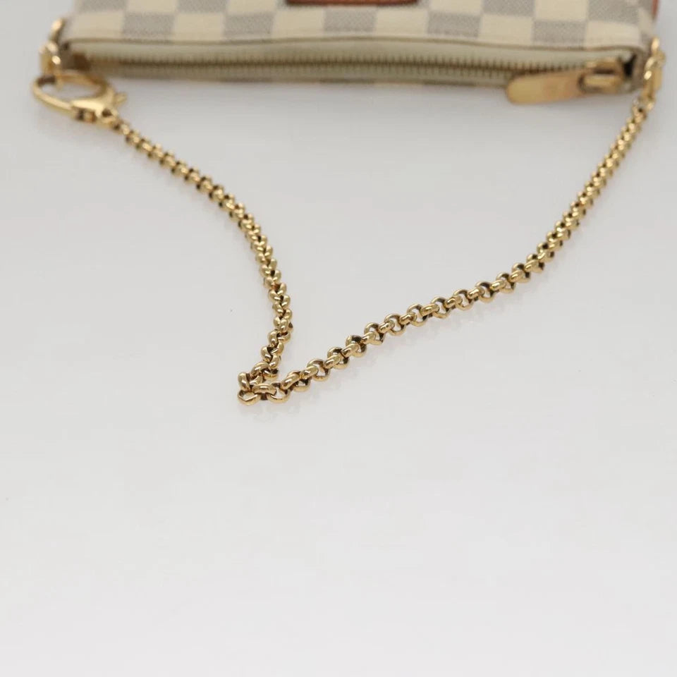 Louis Vuitton   |    Mira White Canvas Clutch Bag