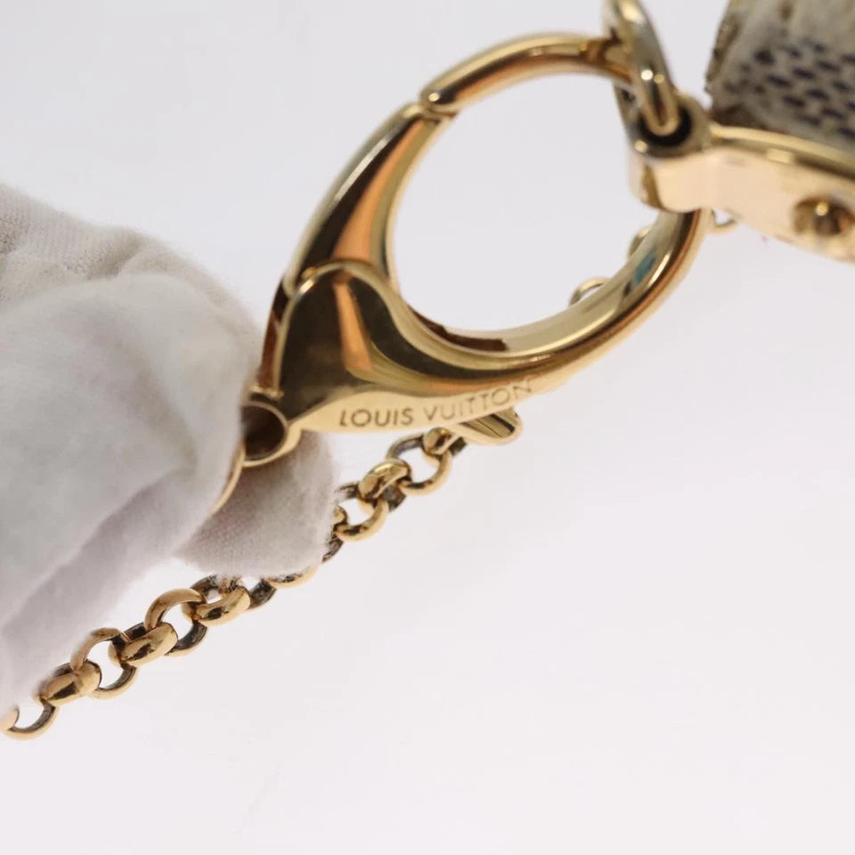 Louis Vuitton   |    Mira White Canvas Clutch Bag