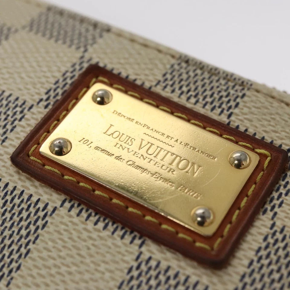 Louis Vuitton   |    Mira White Canvas Clutch Bag