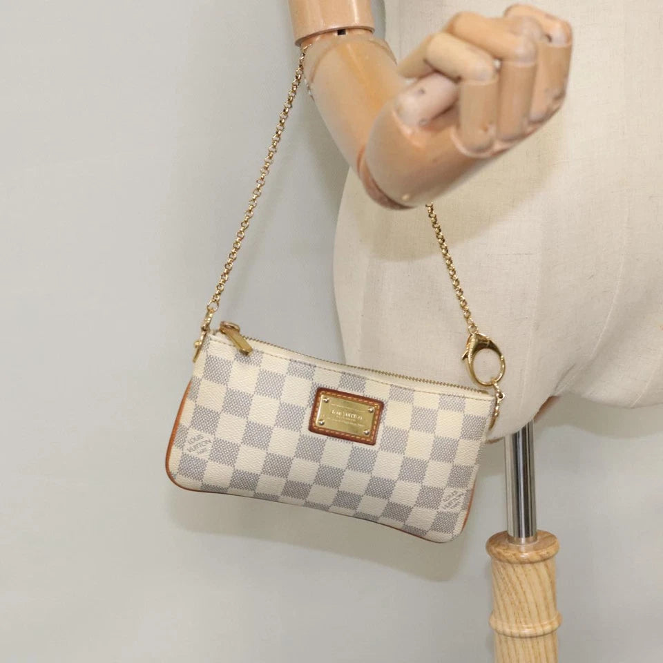 Louis Vuitton   |    Mira White Canvas Clutch Bag